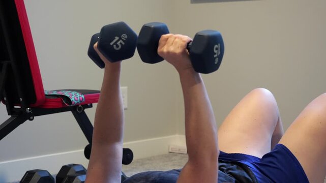 Woman Doing Video Workout in Home Gym - Home Fitness Exercise Weightlifting Healthy Lifestyle Building Muscle Daily to Age Gracefully