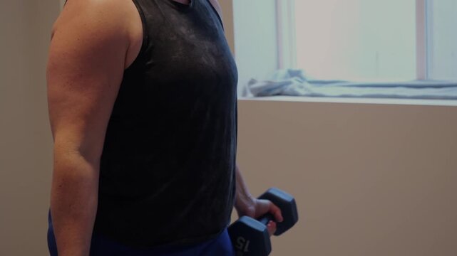Woman Doing Video Workout in Home Gym - Home Fitness Exercise Weightlifting Healthy Lifestyle Building Muscle Daily to Age Gracefully