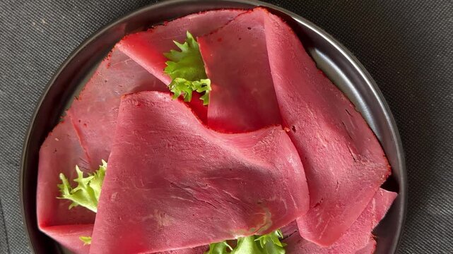 Beef ham thin slices of veal ham meat dish lunch or dinner tasty snack fresh gourmet food background on the table rustic food close-up copy space