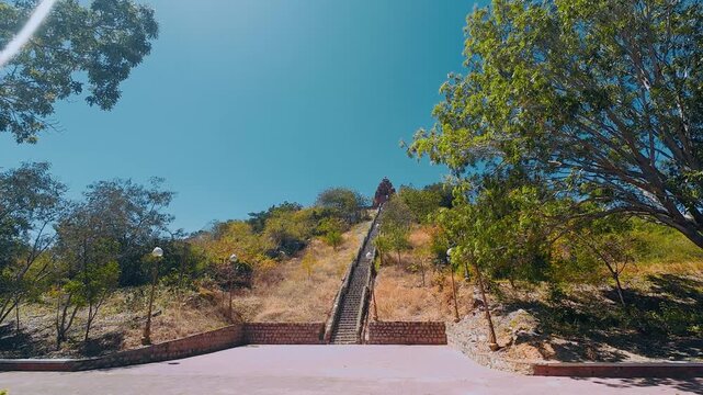 Po Klong Garai Cham Towers Ancient Hindu Temple on Hillside with Long Stone Stairs Under Blue Sky in Ninh Thuan Vietnam