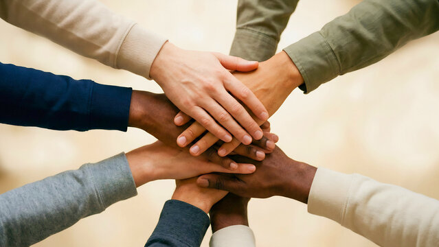 Diverse hands of different skin tones stacked together in team unity, diversity inclusion concept, multicultural workplace, team collaboration unity, equality workforce, inclusive business