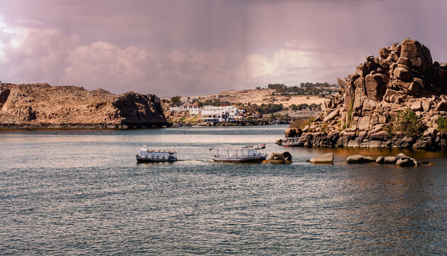 Nubian traditional house on the bank of the Nile. Stormy sky Aswan, Egypt