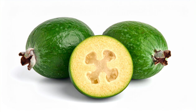 Two whole green Feijoa sellowiana (pineapple guava) fruits with a half slice isolated on white background. Fresh Acca sellowiana or pineapple guava showing juicy pulp and seeds, tropical organic food.