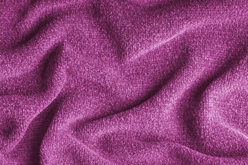 Closeup, macro of pink microfiber fabric texture with soft folds and drapery. Plush, fleece textile surface suitable for background, wallpaper and design use. Upholstery, decorative cloth © katyamaximenko