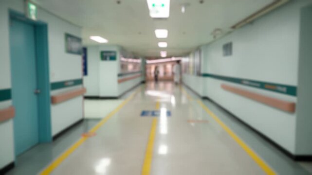 Defocused blurred video of the Busy Hospital Hallway Specialists Preparing for the Day Ahead in Hospital. Female and Male Physicians, Surgeons,