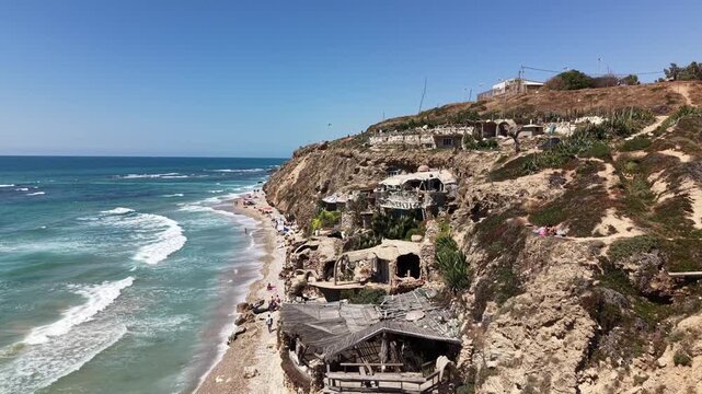 Aerial view of Sidna Ali Beach and The Artistic House with cliffside architecture Mediterranean coastline and sandy shoreline near Herzliya Israel
