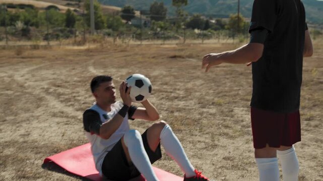 Two Players Passing The Ball To Each Other During Players
