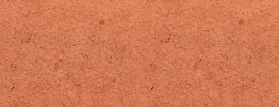Textured Earth Tones: A close-up view of reddish-brown clay soil, showcasing its granular texture and natural earthy hues, perfect for backgrounds or design elements.