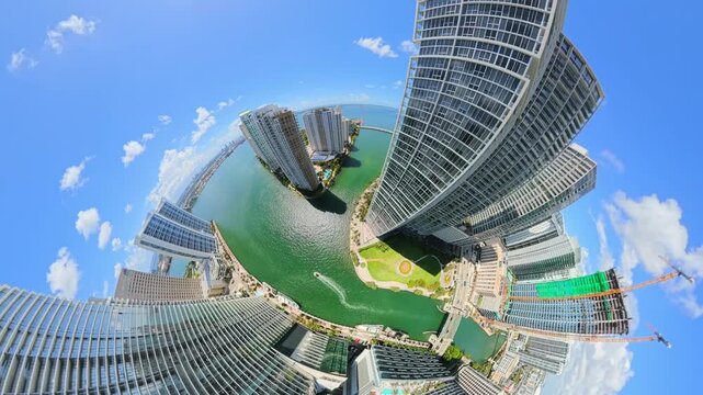 Aerial video tiny planet of skyscrapers Downtown Miami river Brickell 4k 60p