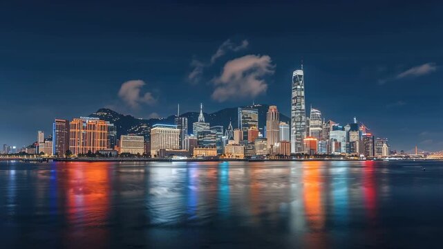 Night skyline reflection panorama of illuminated waterfront skyscraper reflections calm water