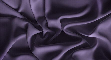Fototapeta premium Soft muted lavender, amethyst smoke silk satin fabric material. Luxury elegant background. Shiny smooth waves. Abstract velvet wallpaper. Opulent bedding, sheet, curtain. Business, web design, banner
