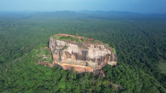 Aerial drone footage of Lion Rock in the city of Sigiriya in Sri Lanka on a sunny day, 4k 30fps, 1 inch sensor