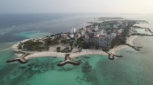 Aerial footage of Maafushi beaches in the Maldives atoll on a sunny day, 4k 30fps, 1 inch sensor drone