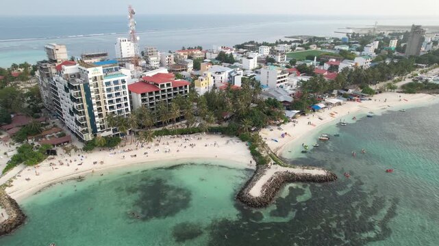 Aerial footage of Maafushi beaches in the Maldives atoll on a sunny day, 4k 30fps, 1 inch sensor drone