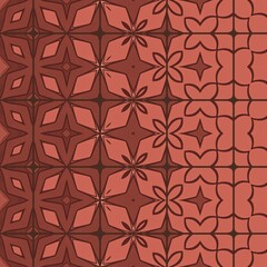 Fototapeta premium A red background with a pattern of stars and flowers. The stars are in different sizes and are scattered throughout the image
