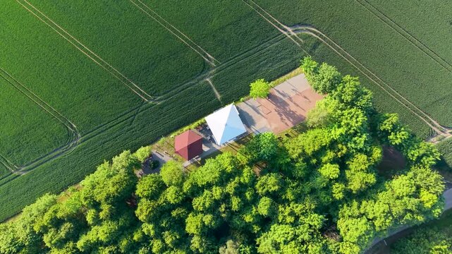 Aerial drone view of observation tower in Pietrowice Wielkie surrounded by farmland