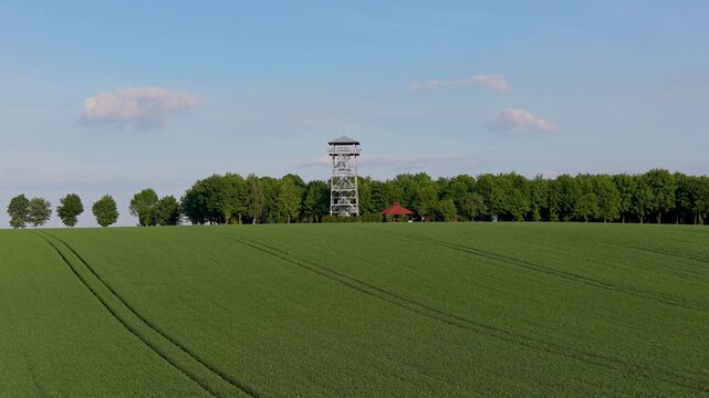 Aerial drone view of observation tower in Pietrowice Wielkie surrounded by farmland