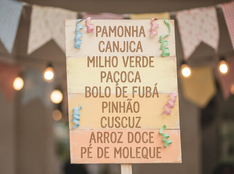 Close Up of Rustic Wooden Signboard Showing Festival Dishes