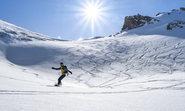 Snowboarder with splitboard rides in the snow, ski tour Geierspitze, Wattentaler Lizum, Tuxer Alps, Tyrol, Austria