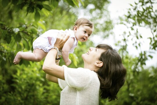 Mother with baby in the garden, Family, Bavaria, Germany