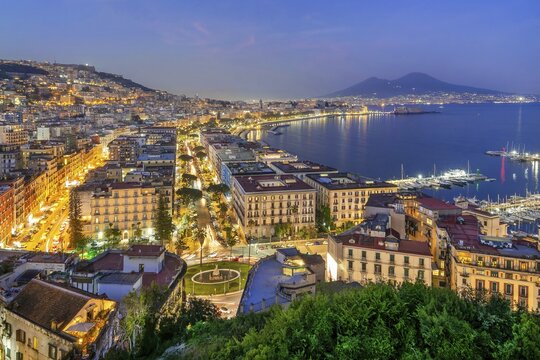 Western district of Mergellina by the sea with the Vomero and Mount Vesuvius 1281m at dusk, Naples, Gulf of Naples, Campania, Italy