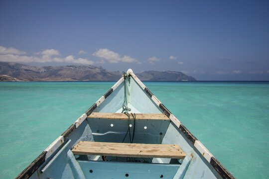 Fishing boat in the turquoise waters in Shuab Bay, island of Socotra, Yemen