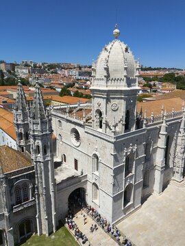Large Gothic cathedral with high towers and a dome, surrounded by a cityscape under a blue sky, aerial view, Hieronymus Monastery, Mosteiro dos Jer&oacute;nimos, Hieronymite Monastery, World Heritage Site, Monastery Church of Santa Maria, Bel&eacute;m, Belem, Bethlehem, Lisbon, Lisboa, Portugal
