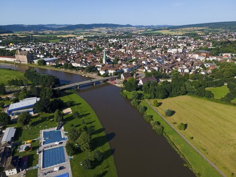 Drone shot of the Weser with outdoor pool and Holzminden, Weserbergland, Lower Saxony, Germany