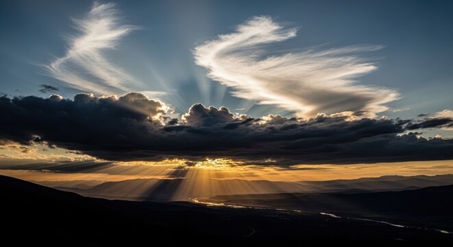 Sunbeams Pierce Dramatic Clouds at Sunrise or Sunset