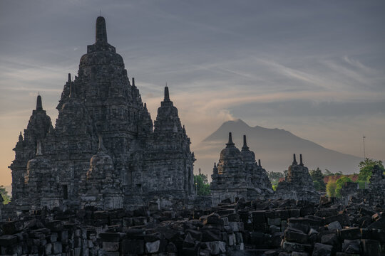 View of Sewu temple or called Candi Sewu at sunset with Merapi volcano on background, part of Prambanan Hindu temple, located on Klaten, Indonesia