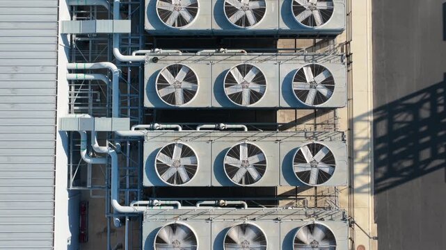 Top Down Closeup View of Industrial Cooling Fans on Data Center Rooftop. San Antonio Texas.