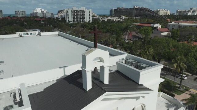 Close-up aerial shot of the steeple on top of the St. Agnes Catholic Church in Key Biscayne, FL.