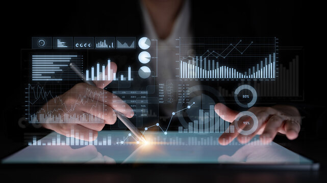 A business professional uses a digital tablet to analyze data trends, showcasing dynamic graphs and statistics that aid in strategic decision making and performance insights. Scalp