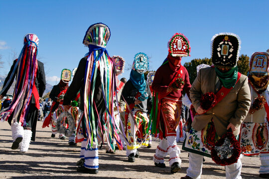 Masked Matachines dancers in colorful regalia
