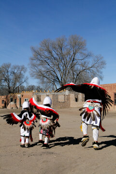 Eagle dancers in feathered dress at a New Mexico pueblo