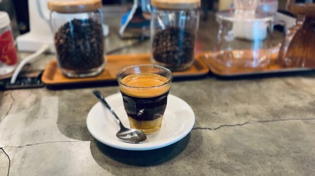 Caf&eacute; Bombon: Spanish Coffee With Condensed Milk. The classic version is served in a clear glass, dark coffee layer sitting above the pale condensed milk.