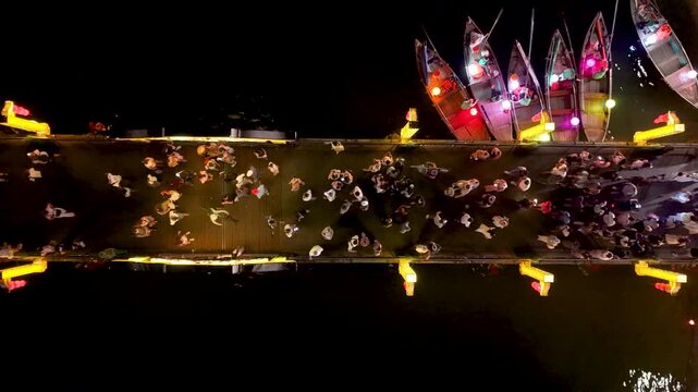 Panorama aerial drone view of Hoi An ancient town with boat tour and beautiful lanterns in night. UNESCO world heritage. One of the most travel popular touristic destinations