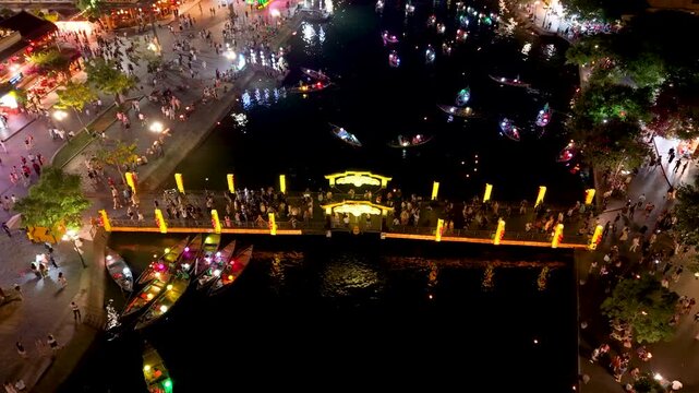 Panorama aerial drone view of Hoi An ancient town with boat tour and beautiful lanterns in night. UNESCO world heritage. One of the most travel popular touristic destinations