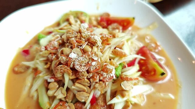 Thai papaya salad called Somtum.