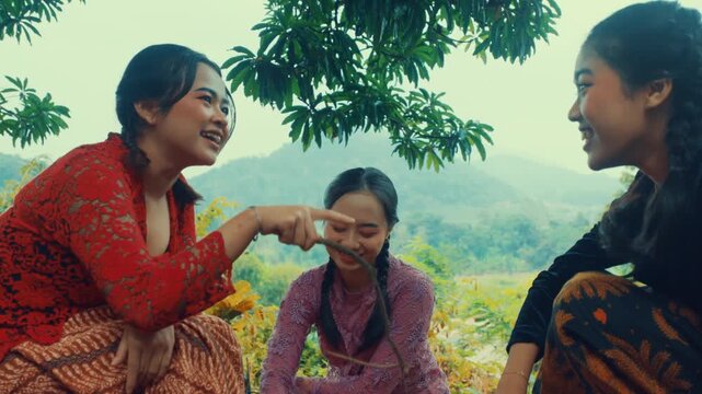 Cheerful Indonesian Girls Joking Together