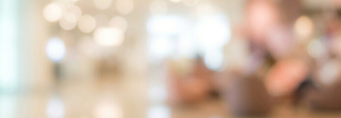Fototapeta premium A blurred background of a modern indoor space, featuring soft bokeh lights and an inviting atmosphere suitable for a cozy café or social gathering.