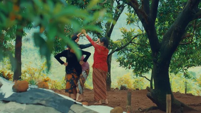 Javanese Women Playing Under a Tree