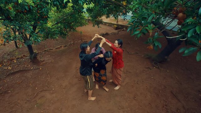 Asian Women Playing Ular Naga Folk Game