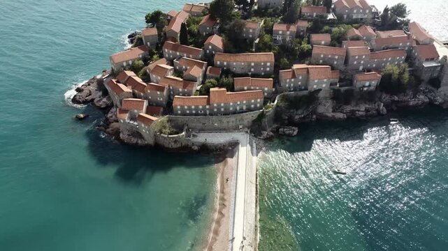 Drone flight aerial view of Sveti Stefan island - hotel. Montenegro, Europe