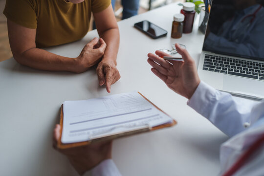 Doctor discussing medical information with senior patient