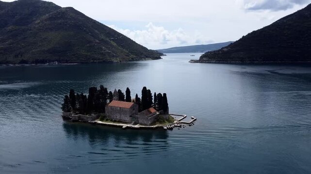 Drone view of the Church of Our Lady of the Rocks and Island of Saint George, Bay of Kotor near Perast.