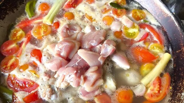 Cooking Tom Kha Gai in pan, Thai famous food.