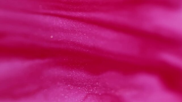 Vertical video. Paint background. Color water. Defocused pink glitter sparkling flow chemical fluid drip floating on abstract art.