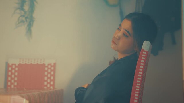 Tired Woman Resting Head on Chair in Hazy Setting