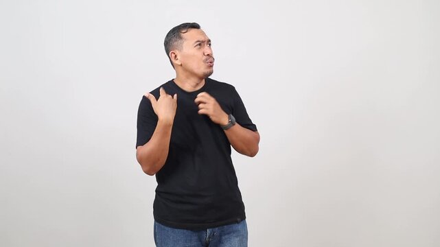 Asian man with sweat stain on his shirt suffering from hot weather. Problem with hyperhidrosis